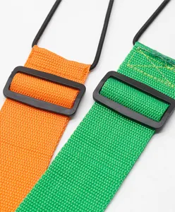 Adjustable luggage strap with elastic cord and plastic buckle for secure travel packing.