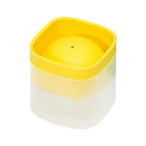 Square silicone ice ball maker mold for whiskey and home kitchen use, yellow and white.