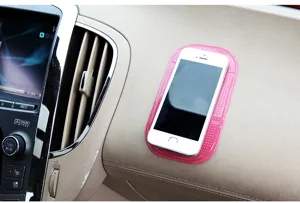 Pink silicone car anti-slip mat, dashboard sticky pad holder for mobile phone and small items.