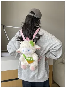 Cute cartoon lamb plush backpack with pink straps and green floral pocket for daily use.