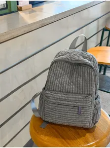 Casual quilted plaid backpack detail, lightweight school bag for women and daily commute.