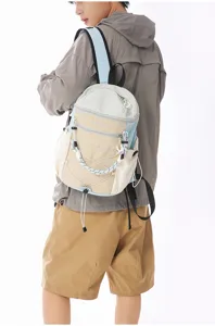 Contrast color backpack with outdoor bungee cords, casual commuting and daily sports bag.