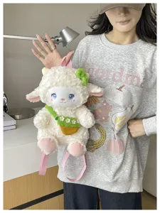 Detailed shot of cute cartoon fluffy sheep plush backpack with pink straps and bow.