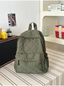 Detailed view of the green plaid quilted casual backpack showcasing texture and craftsmanship.