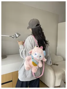 Detailed view of the cute plush sheep backpack, showing soft pink fabric and sweet design.