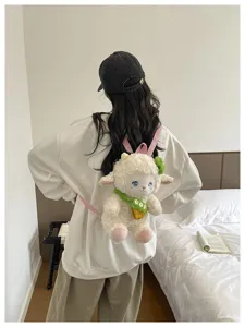 Cute plush lamb backpack for women, fluffy white sheep school bag with adorable carrot charm.