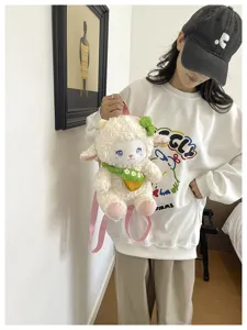 Cute plush lamb backpack detail showing soft white material and lovely floral scarf accessory.
