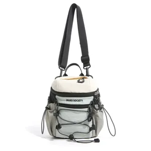 Detailed view of color-blocking multi-pocket backpack with adjustable straps and cords.