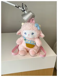 Cute plush lamb backpack with pink fleece and adorable blue bow, soft and stylish for daily use.