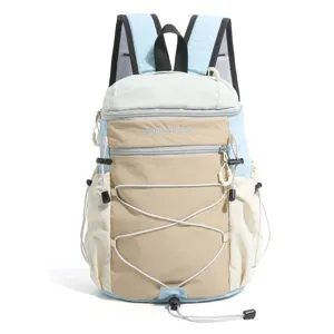 Detailed view of the color-blocked lightweight backpack with front drawstrings and pockets.