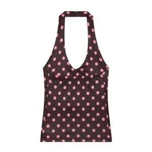 Brown and pink polka dot halter top detail, stylish summer sleeveless crop top for women.