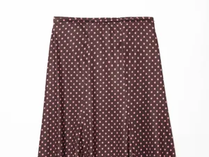 Brown and pink polka dot skirt detail shot, comfortable elastic waist, fashionable style.