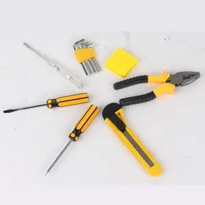 Detailed view of car emergency hardware tool set featuring screwdrivers, pliers and utility knife.