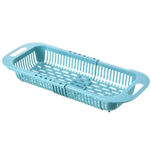 Cestello scolapiatti retrattile per lavello da cucina in blu, colino per verdure regolabile.