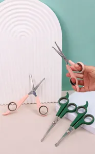 Professional pet grooming scissors with safety round tips and ergonomic handles for pets.