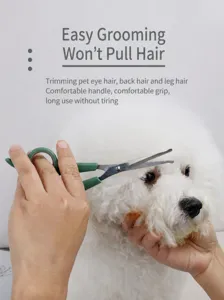 Pet grooming scissors with green handle, sharp stainless steel blade for easy hair trimming.