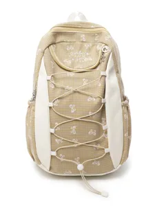 Süßer gelber Karo-Rucksack für Schüler, geräumige Schultasche mit niedlichen Schleifenmustern.