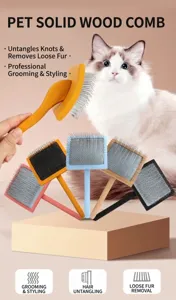 Solid wood pet slicker brush detail view, soft touch handle with fine metal pins for grooming.