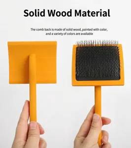 Wooden handle pet slicker brush detail view, showing the solid wood back and metal pins clearly.