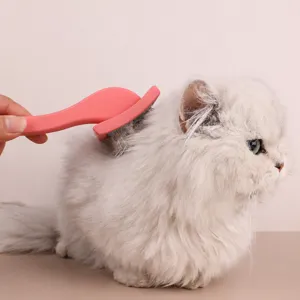 Pink pet slicker brush for long-haired cats and dogs, angled pin design for easy grooming.