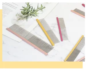 Detailed view of colorful metal pet grooming combs, neat alignment on marble background.