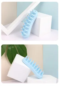 Silicone pet bath brush detail shot, soft massage grooming tool for dogs and cats. Blue color.