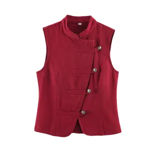 Detailed view of the red sleeveless denim vest, featuring mandarin collar and metal buttons.