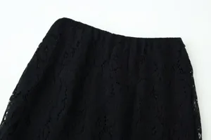 Detailed close-up view of black lace women clothing fabric texture and fashion design.