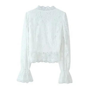 Close-up detail of white lace long-sleeve blouse featuring exquisite stand collar and cuffs.