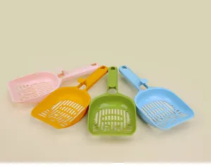 Cat litter scoop detail view, plastic pet poop cleaning tool with cute cat face hollow design.