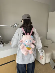 Cute cartoon lamb plush backpack for women, fluffy pink animal doll school bag and daypack.
