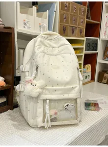 Detailansicht des niedlichen Studentenrucksacks mit Sternenmuster und transparenter Vordertasche.