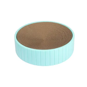 Round cat scratcher bowl with durable corrugated paper core and blue plastic frame for pet care.