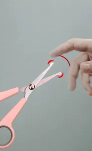 Pet grooming scissors detail showing safe round tip design, pink handle, ideal for cats dogs.