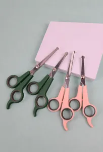 Pet grooming scissors detail, stainless steel safety round tip shear, pink and green handle.