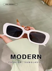 Detail close-up of trendy white frame sunglasses with dark lenses, modern fashion street style.