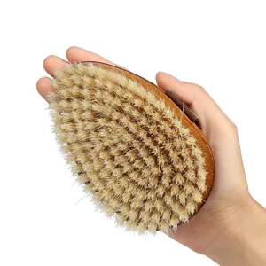 Wooden teardrop pet bath brush with soft bristles, ideal for grooming, massaging dogs and cats.