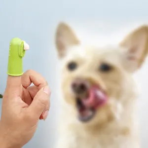 Brosse à dents de doigt en silicone pour animaux de compagnie, soin dentaire doux et sûr.