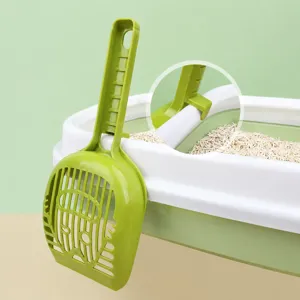 Green plastic cat litter scoop with hanging design, hollow cute cat face shape for easy cleaning.