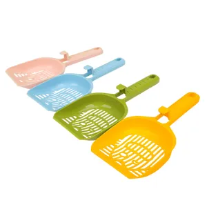 Colorful plastic cat litter scoop with hollow cat face design and hangable handle for pets.