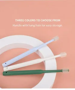 Detailed view of 360-degree silicone pet toothbrushes in three colors with hanging hole handles.