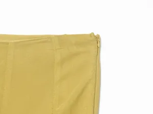 Yellow women skirt side zipper detail close up fashion apparel elegant clothing element view
