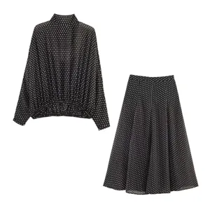Elegant black and white polka dot long sleeve blouse and midi skirt matching outfit
