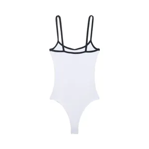 Detail of white contrast trim bodysuit, showcasing fine straps and soft ribbed fabric texture.