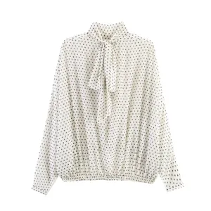 Elegant white polka dot blouse featuring a chic bow tie neck and long sleeves for women.