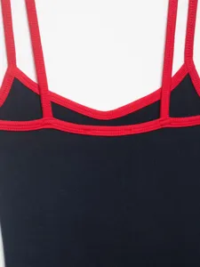 Close-up detail shot of the contrast trim ribbed camisole showing double strap design.