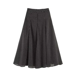 Classic black and white polka dot midi skirt detail view, elegant A-line flowy design.