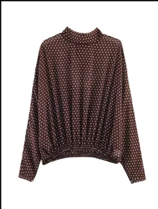 Brown long sleeve polka dot blouse, elegant mock neck and elastic gathered hem detail.