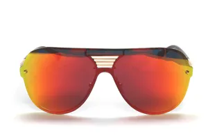 Detailed close-up of oversized shield sunglasses with red reflective lenses and gold details.