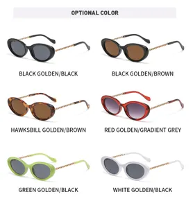 Detailansicht modischer ovaler Sonnenbrillen mit eleganten Kettenbuegeln in verschiedenen Farben.
